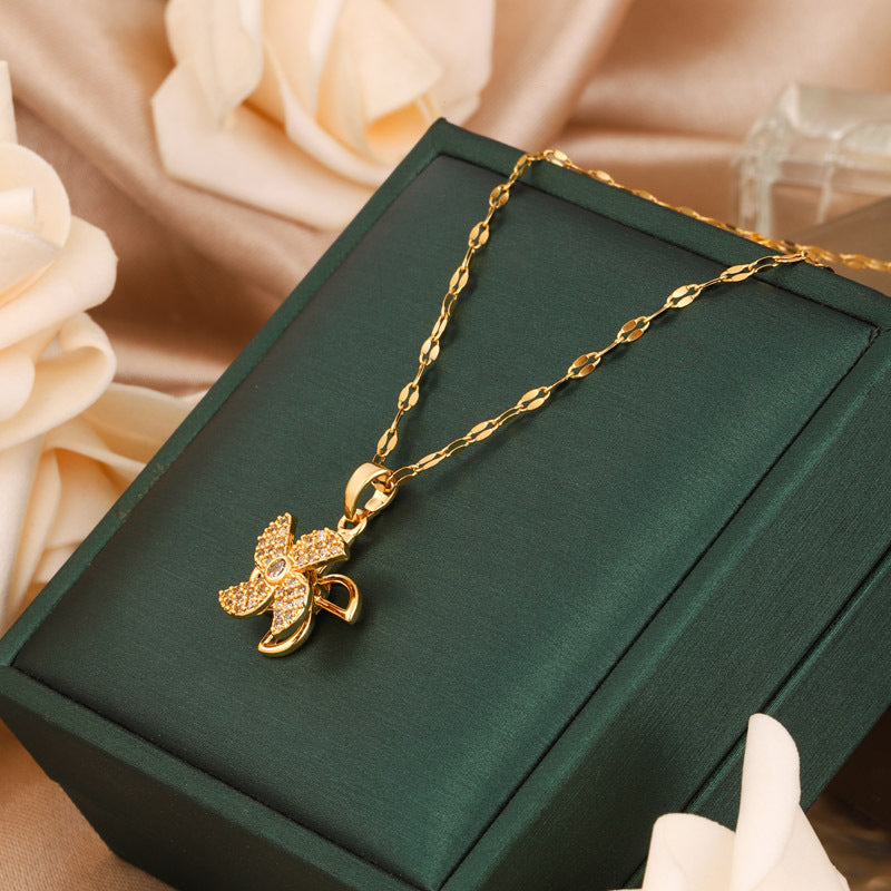 Luxury Rotating Four-Leaf Clover Windmill Necklace – Gold Titanium Steel